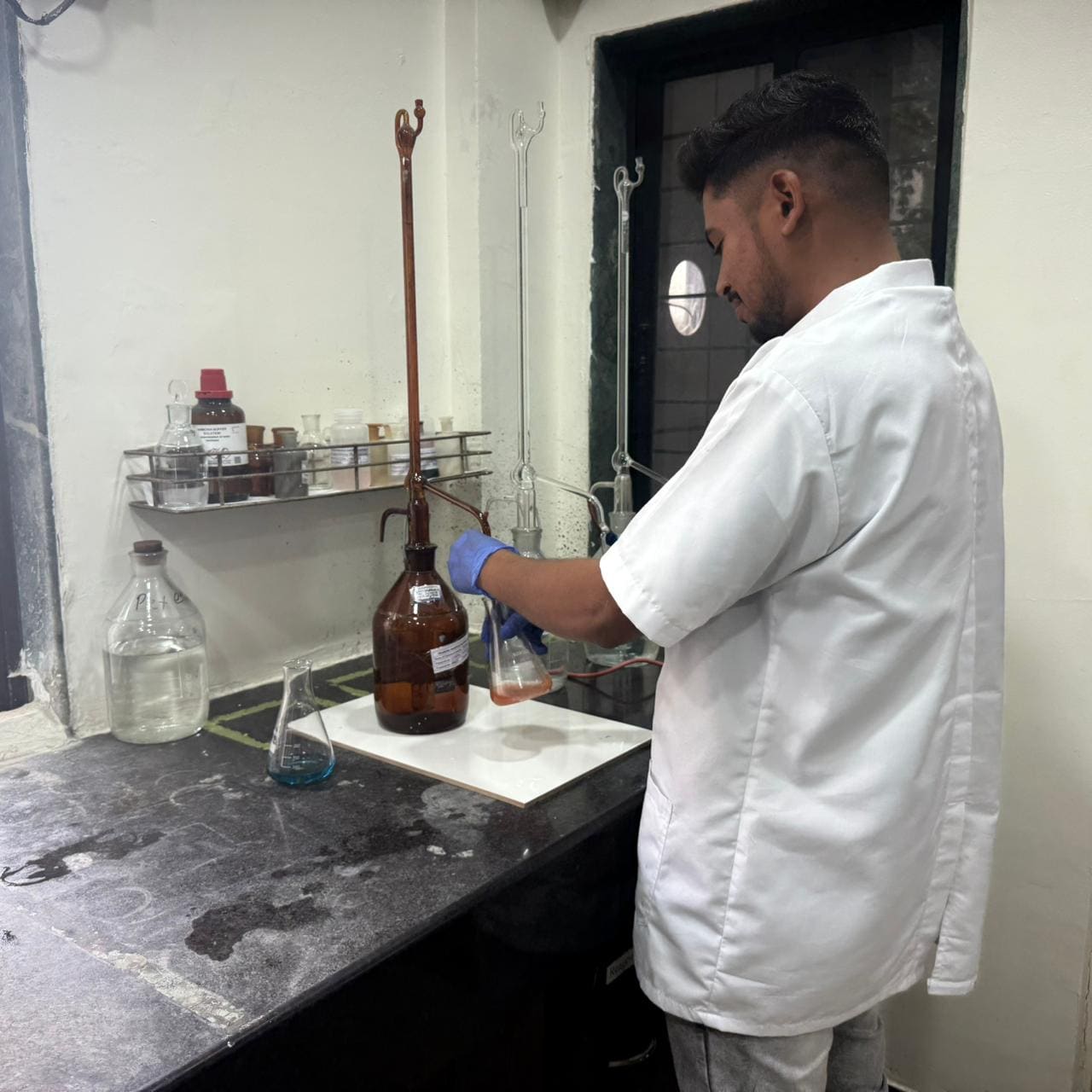 Analyst conducting titration